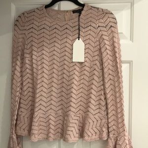Long sleeved peplum knit blouse never worn